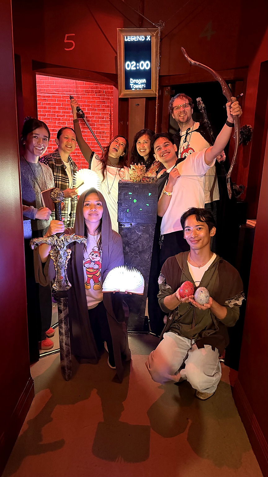 A smiling Dragon Tower group celebrating together