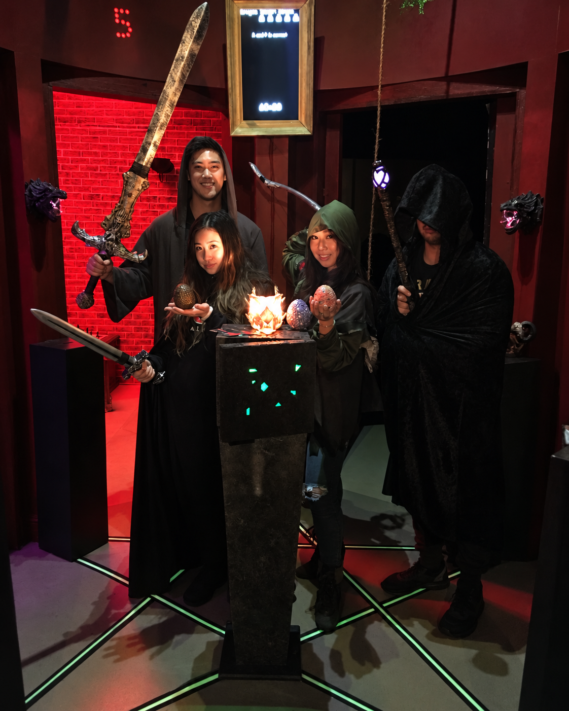 Four costumed Dragon Tower players posing together