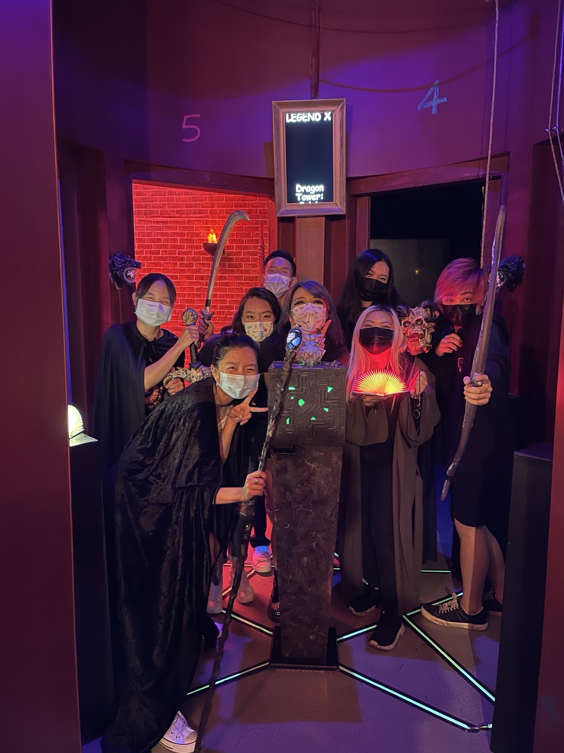 A Dragon Tower team with glowing props and costumes